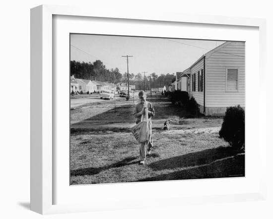 Paper Boy Delivering Newspapers in His Neighborhood-Ed Clark-Framed Photographic Print