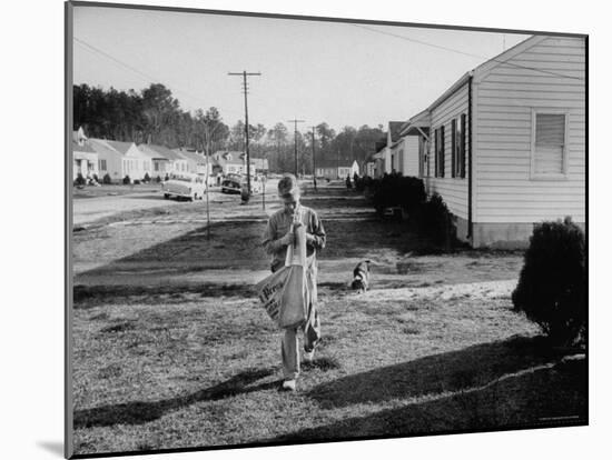 Paper Boy Delivering Newspapers in His Neighborhood-Ed Clark-Mounted Photographic Print