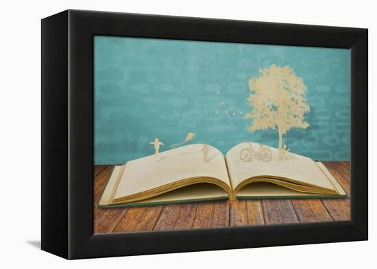 Paper Cut of Children Play on Old Book-jannoon028-Framed Premier Image Canvas