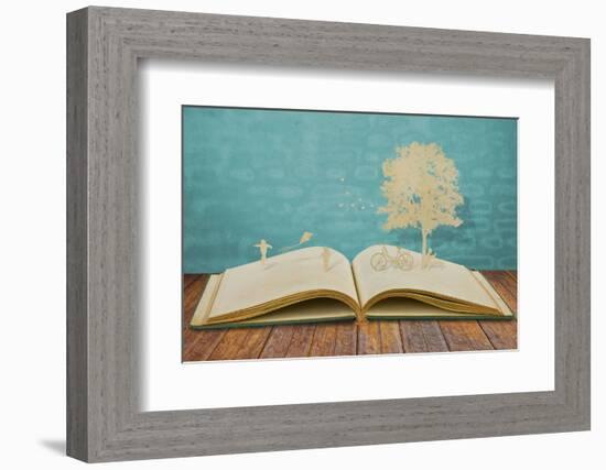 Paper Cut of Children Play on Old Book-jannoon028-Framed Photographic Print