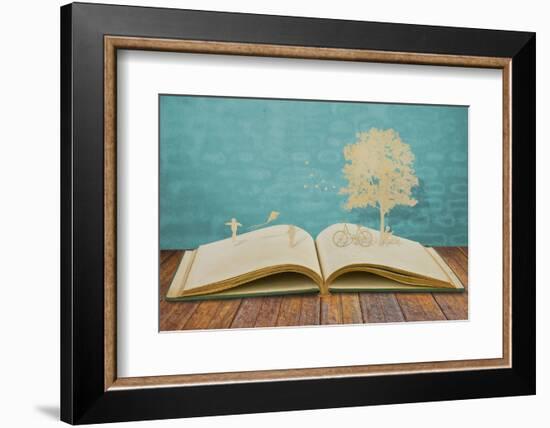 Paper Cut of Children Play on Old Book-jannoon028-Framed Photographic Print