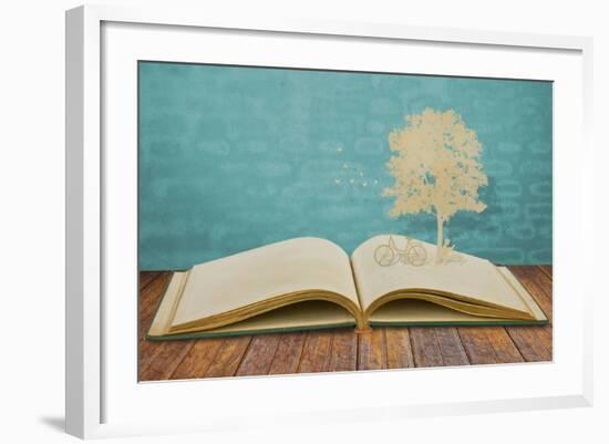 Paper Cut Of Children Read A Book Under Tree On Old Book-jannoon028-Framed Art Print