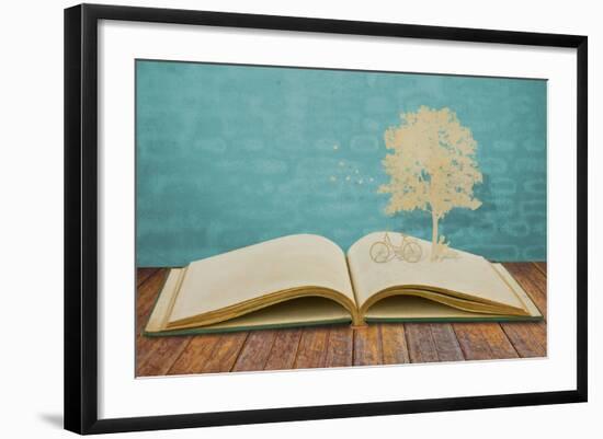 Paper Cut Of Children Read A Book Under Tree On Old Book-jannoon028-Framed Art Print