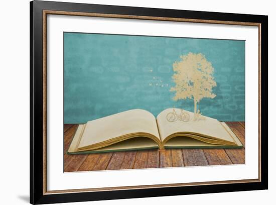 Paper Cut Of Children Read A Book Under Tree On Old Book-jannoon028-Framed Art Print