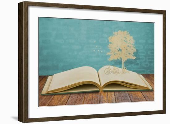 Paper Cut Of Children Read A Book Under Tree On Old Book-jannoon028-Framed Art Print