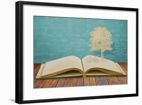 Paper Cut Of Children Read A Book Under Tree On Old Book-jannoon028-Framed Art Print