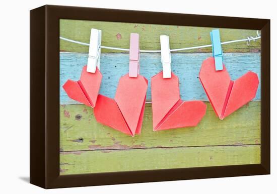 Paper Heart Hanging On The Clothesline. On Old Wood Background-tomgigabite-Framed Stretched Canvas