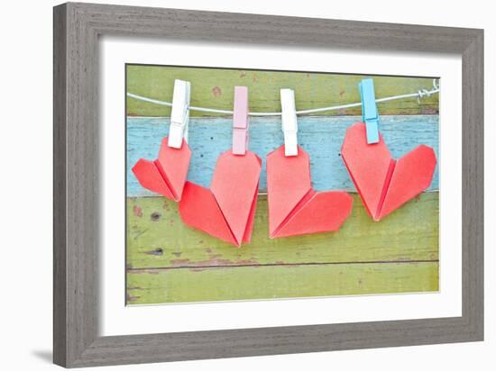 Paper Heart Hanging On The Clothesline. On Old Wood Background-tomgigabite-Framed Art Print