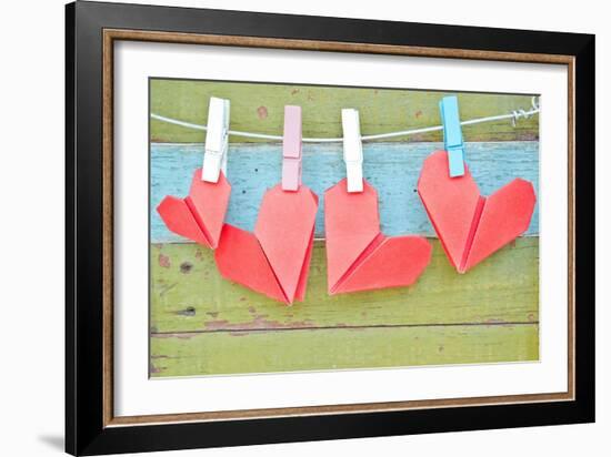 Paper Heart Hanging On The Clothesline. On Old Wood Background-tomgigabite-Framed Art Print