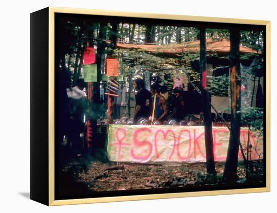 Paraphernalia Stand in Woods Featuring Pillows, Posters, and Incense, Woodstock Music and Art Fair-John Dominis-Framed Premier Image Canvas
