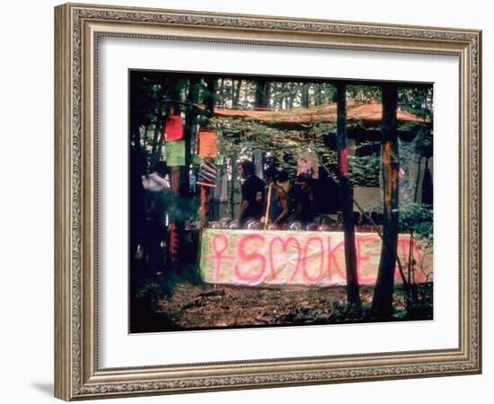 Paraphernalia Stand in Woods Featuring Pillows, Posters, and Incense, Woodstock Music and Art Fair-John Dominis-Framed Premium Photographic Print
