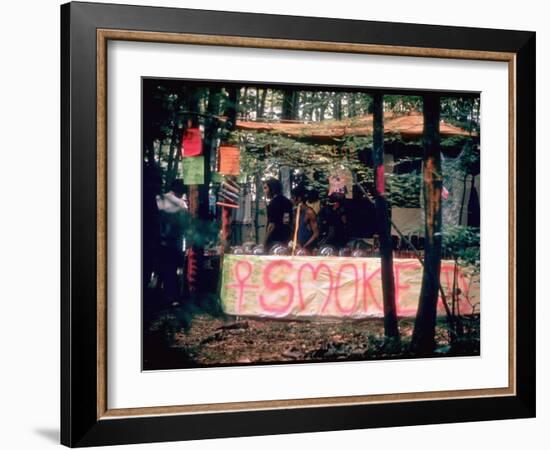 Paraphernalia Stand in Woods Featuring Pillows, Posters, and Incense, Woodstock Music and Art Fair-John Dominis-Framed Premium Photographic Print