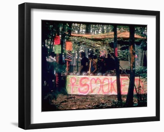 Paraphernalia Stand in Woods Featuring Pillows, Posters, and Incense, Woodstock Music and Art Fair-John Dominis-Framed Premium Photographic Print