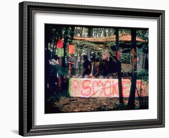 Paraphernalia Stand in Woods Featuring Pillows, Posters, and Incense, Woodstock Music and Art Fair-John Dominis-Framed Premium Photographic Print