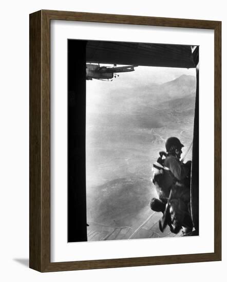 Paratrooper Making Way to Jump Off a Military Plane into Hostile Territories-John Dominis-Framed Photographic Print