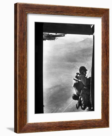 Paratrooper Making Way to Jump Off a Military Plane into Hostile Territories-John Dominis-Framed Photographic Print