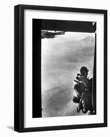 Paratrooper Making Way to Jump Off a Military Plane into Hostile Territories-John Dominis-Framed Photographic Print