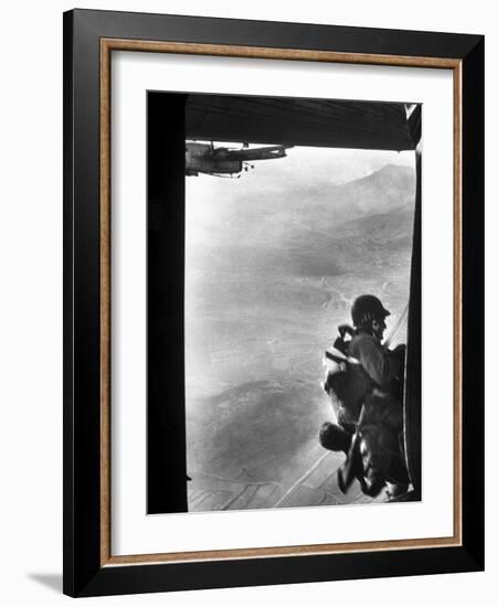 Paratrooper Making Way to Jump Off a Military Plane into Hostile Territories-John Dominis-Framed Photographic Print