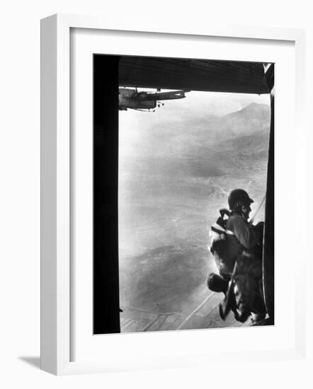 Paratrooper Making Way to Jump Off a Military Plane into Hostile Territories-John Dominis-Framed Photographic Print