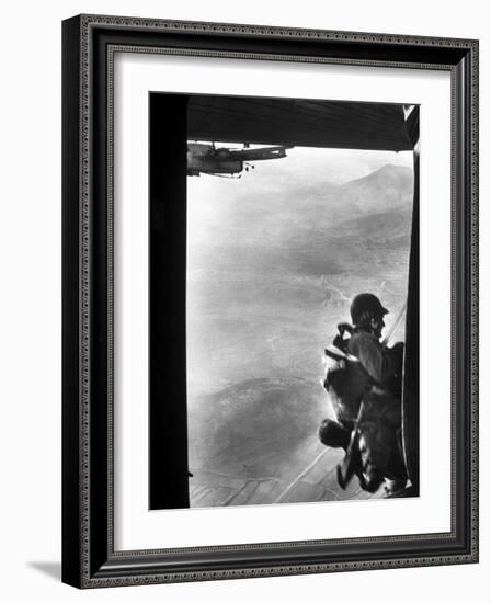 Paratrooper Making Way to Jump Off a Military Plane into Hostile Territories-John Dominis-Framed Photographic Print