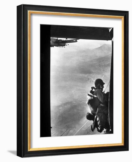 Paratrooper Making Way to Jump Off a Military Plane into Hostile Territories-John Dominis-Framed Photographic Print