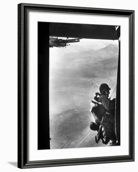 Paratrooper Making Way to Jump Off a Military Plane into Hostile Territories-John Dominis-Framed Photographic Print