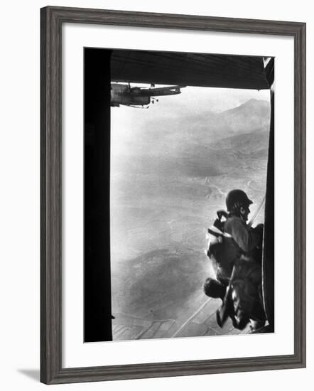 Paratrooper Making Way to Jump Off a Military Plane into Hostile Territories-John Dominis-Framed Photographic Print