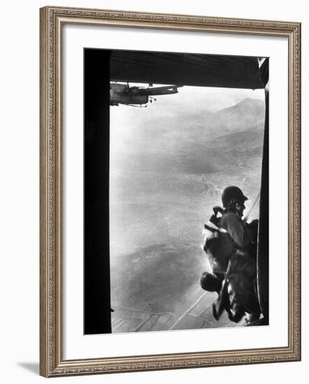 Paratrooper Making Way to Jump Off a Military Plane into Hostile Territories-John Dominis-Framed Photographic Print