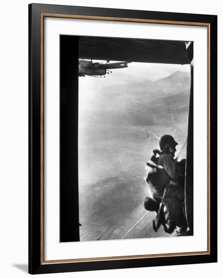 Paratrooper Making Way to Jump Off a Military Plane into Hostile Territories-John Dominis-Framed Photographic Print