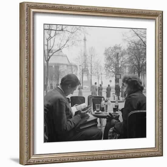 Parisian Couple Drinking Coca Cola at a Sidewalk Cafe While Reading, Paris, France, 1950-Mark Kauffman-Framed Photographic Print