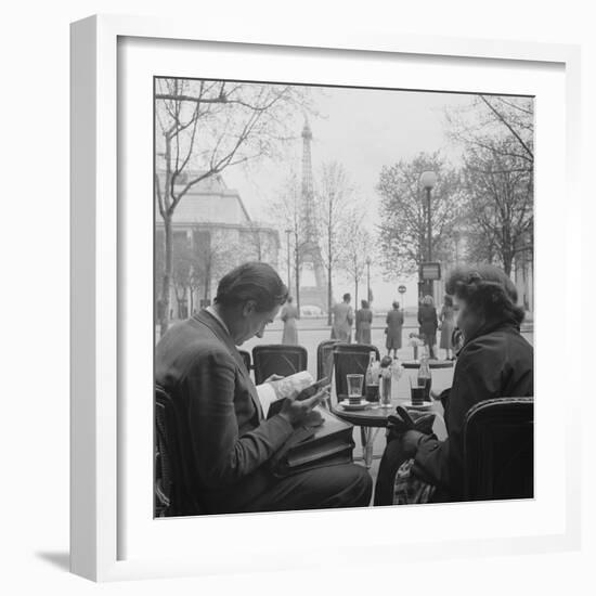 Parisian Couple Drinking Coca Cola at a Sidewalk Cafe While Reading, Paris, France, 1950-Mark Kauffman-Framed Photographic Print