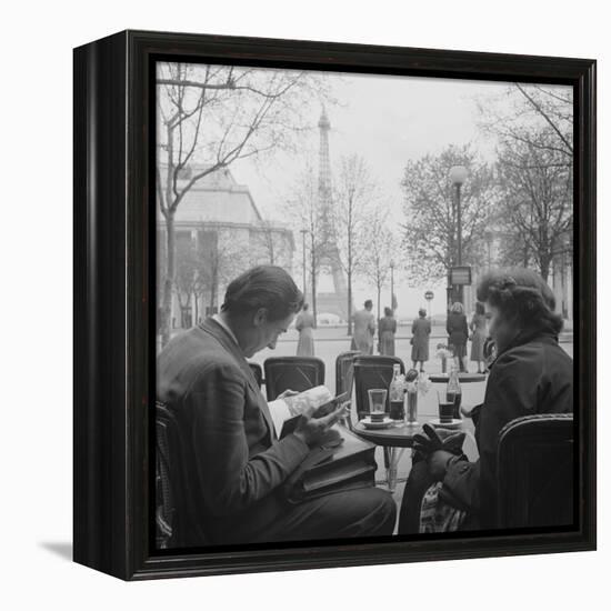 Parisian Couple Drinking Coca Cola at a Sidewalk Cafe While Reading, Paris, France, 1950-Mark Kauffman-Framed Premier Image Canvas