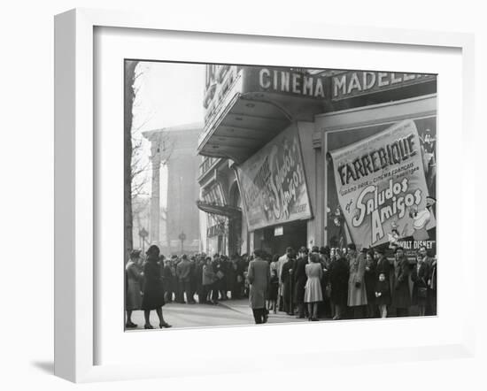 Parisiennes at a Movie Theater Showing the Disney Film, 'Saludos Amigos' in April 1947-null-Framed Premium Photographic Print