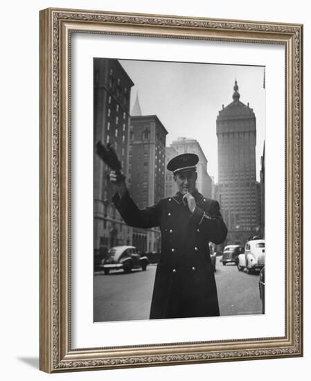 Park Avenue Doorman Using Whistle to Flag Down a Taxi For One of the Residents of His Building-William C^ Shrout-Framed Photographic Print