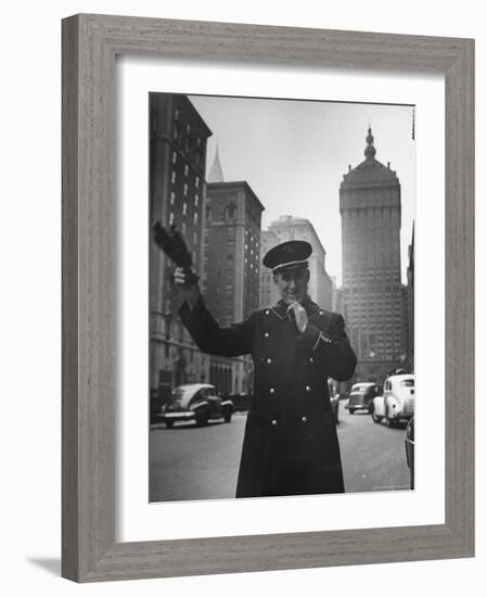 Park Avenue Doorman Using Whistle to Flag Down a Taxi For One of the Residents of His Building-William C^ Shrout-Framed Photographic Print