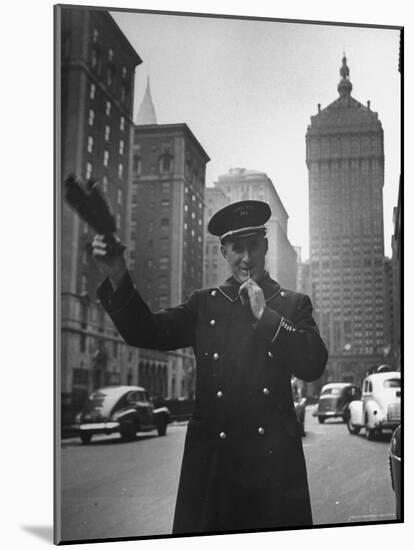 Park Avenue Doorman Using Whistle to Flag Down a Taxi For One of the Residents of His Building-William C^ Shrout-Mounted Photographic Print