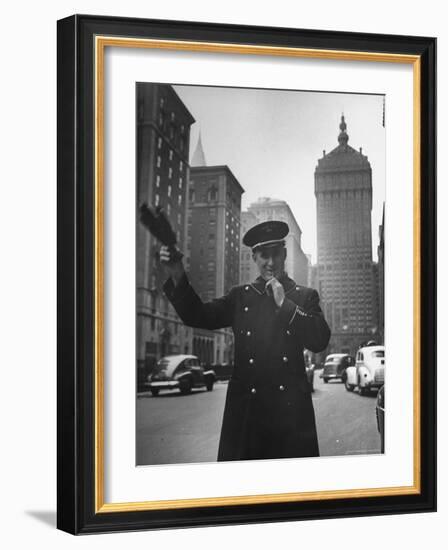 Park Avenue Doorman Using Whistle to Flag Down a Taxi For One of the Residents of His Building-William C^ Shrout-Framed Photographic Print