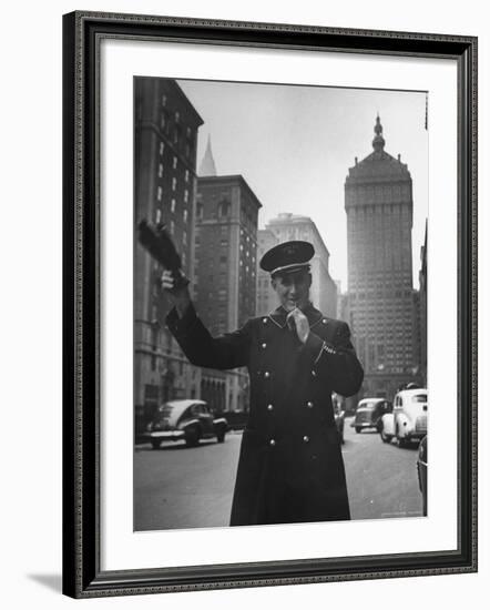 Park Avenue Doorman Using Whistle to Flag Down a Taxi For One of the Residents of His Building-William C^ Shrout-Framed Photographic Print