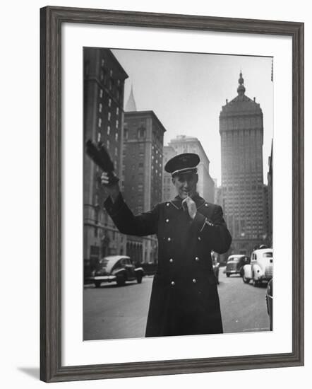 Park Avenue Doorman Using Whistle to Flag Down a Taxi For One of the Residents of His Building-William C^ Shrout-Framed Photographic Print