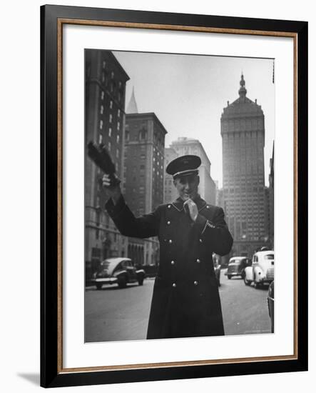 Park Avenue Doorman Using Whistle to Flag Down a Taxi For One of the Residents of His Building-William C^ Shrout-Framed Photographic Print