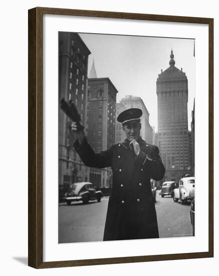 Park Avenue Doorman Using Whistle to Flag Down a Taxi For One of the Residents of His Building-William C^ Shrout-Framed Photographic Print