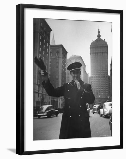 Park Avenue Doorman Using Whistle to Flag Down a Taxi For One of the Residents of His Building-William C^ Shrout-Framed Photographic Print