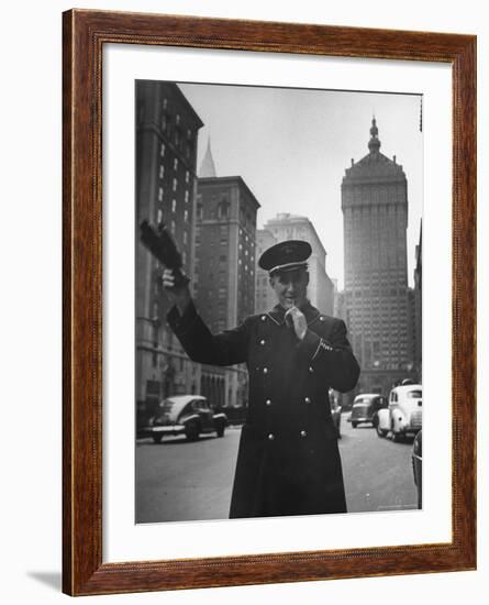 Park Avenue Doorman Using Whistle to Flag Down a Taxi For One of the Residents of His Building-William C^ Shrout-Framed Photographic Print