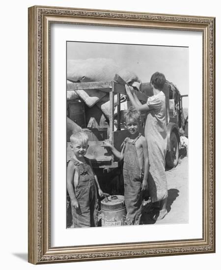 Part of an impoverished family of nine from Iowa on a New Mexico highway, 1936-Dorothea Lange-Framed Photographic Print