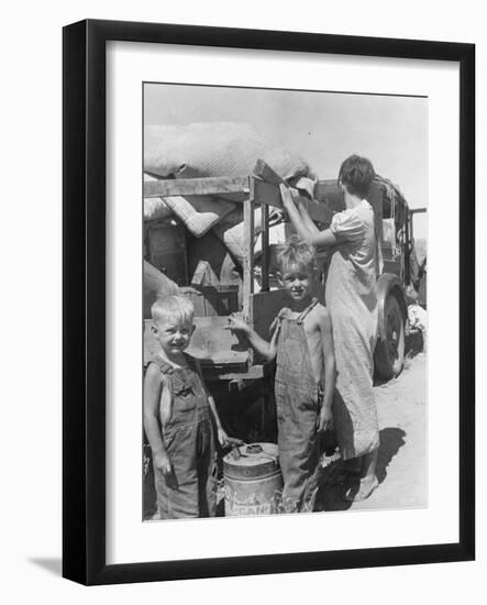 Part of an impoverished family of nine from Iowa on a New Mexico highway, 1936-Dorothea Lange-Framed Photographic Print