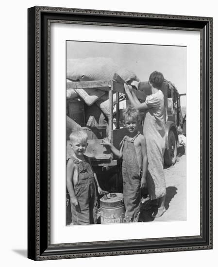 Part of an impoverished family of nine from Iowa on a New Mexico highway, 1936-Dorothea Lange-Framed Photographic Print