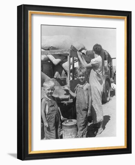 Part of an impoverished family of nine from Iowa on a New Mexico highway, 1936-Dorothea Lange-Framed Photographic Print