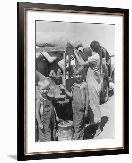 Part of an impoverished family of nine from Iowa on a New Mexico highway, 1936-Dorothea Lange-Framed Photographic Print