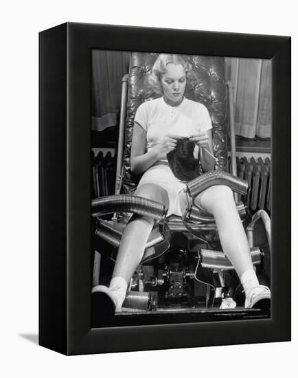 Pat Ogden at Slenderizing Salon Knitting in Padded Chair While Leg Rollers Work from Thigh to Ankle-Alfred Eisenstaedt-Framed Premier Image Canvas