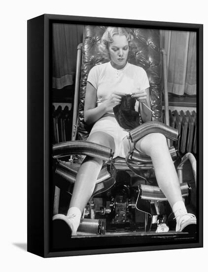Pat Ogden at Slenderizing Salon Knitting in Padded Chair While Leg Rollers Work from Thigh to Ankle-Alfred Eisenstaedt-Framed Premier Image Canvas